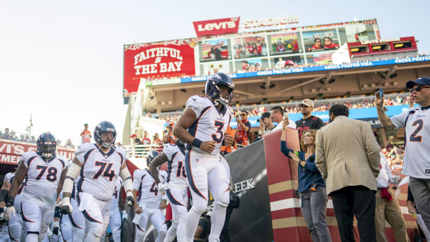 Denver Broncos quarterback Russell Wilson (3) runs out to the field before the game against the San Francisco 49ers at Levi's Stadium.