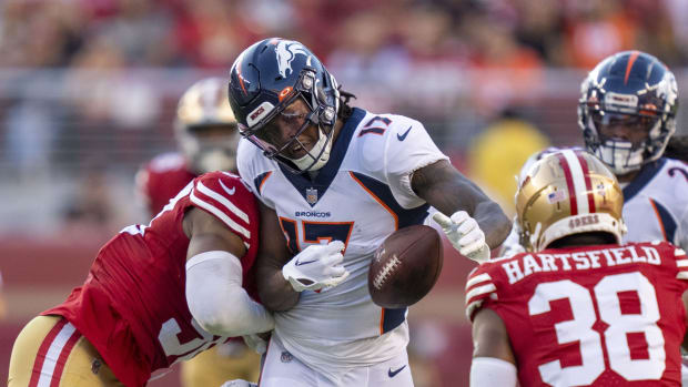 Denver Broncos wide receiver Lil'Jordan Humphrey (17) fumbles the ball while being hit by San Francisco 49ers linebacker Jalen Graham (50) during the third quarter at Levi's Stadium.