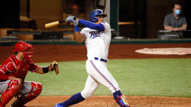 Texas Rangers first baseman Ronald Guzmán hits a two-run single during the fourth inning against the Los Angeles Angels at Globe Life Field. (2020)