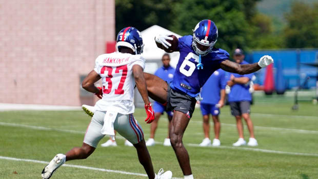 New York Giants rookie wide receiver Bryce Ford-Wheaton (6) makes a catch over rookie cornerback Tre Hawkins III on the first day of training camp in East Rutherford on Wednesday, July 26, 2023.