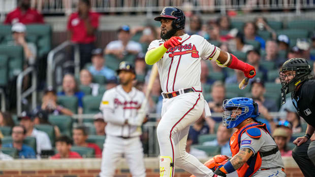 Aug 22, 2023; Cumberland, Georgia, USA; Atlanta Braves designated hitter Marcell Ozuna (20) follows through after hitting a single against the New York Mets during the second inning at Truist Park.