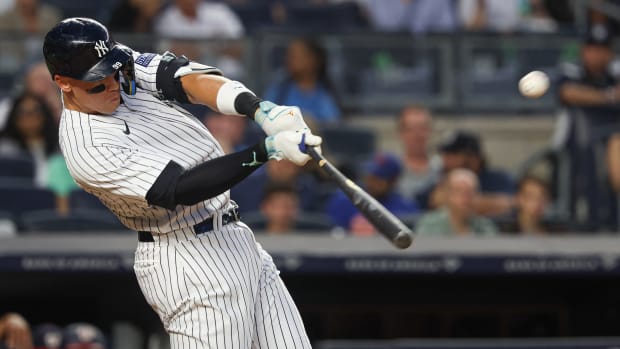 Yankees right fielder Aaron Judge (99) hits a grand slam home run during the second inning of a game against the Nationals.