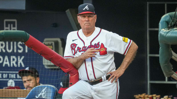 Aug 23, 2023; Cumberland, Georgia, USA; Atlanta Braves manager Brian Snitker (43) shown in the dugout against the New York Mets during the first inning at Truist Park. Mandatory Credit: Dale Zanine-USA TODAY Sports  