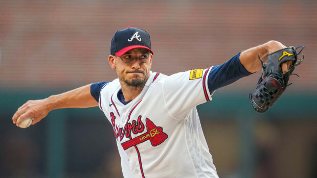 Aug 23, 2023; Cumberland, Georgia, USA; Atlanta Braves starting pitcher Charlie Morton (50) pitches against the New York Mets during the first inning at Truist Park. Mandatory Credit: Dale Zanine-USA TODAY Sports  
