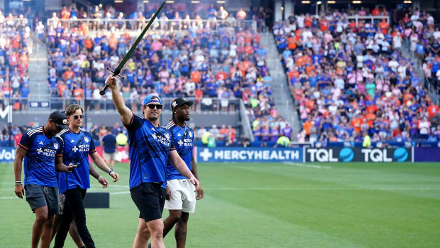 Cincinnati Bengals defensive end Sam Hubbard, joined by quarterback Joe Burrow, wide receivers Ja Marr Chase, Tyler Boyd and Tee Higgins, participates in a pregame ritual before the first half of a U.S. Open Cup semifinal match between Inter Miami and FC Cincinnati, Wednesday, Aug. 23, 2023, at TQL Stadium in Cincinnati.