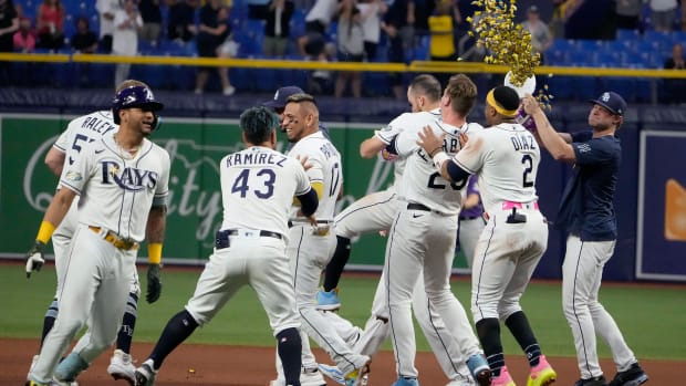 Aug 23, 2023; St. Petersburg, Florida, USA; Tampa Bay Rays players celebrate after defeating the Colorado Rockies in ten innings at Tropicana Field.
