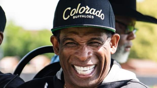Deion Sanders smiling at CU Fall Camp