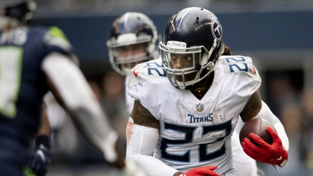 Running back Derrick Henry (22), in action against Seattle Seahawks in Seattle, Wash., on Sept. 19, was the Tennessee Titans' leading rusher for 2021 with 937 yards on 219 carries with 10 rushing touchdowns.  