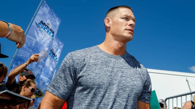 Wrestler John Cena looks on while attending the Daytona 500.