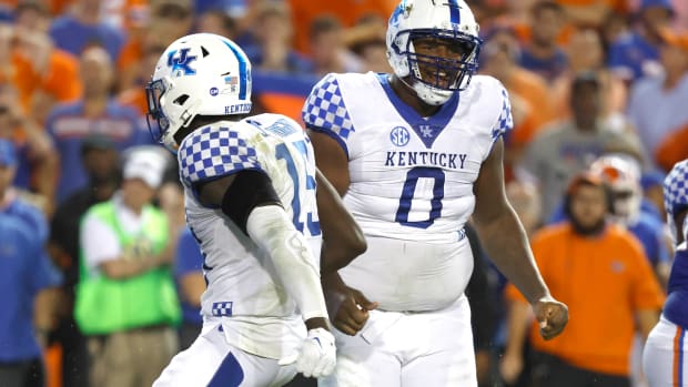 Sep 10, 2022; Gainesville, Florida, USA; Kentucky Wildcats defensive tackle Deone Walker (0) reacts after making a tackle against the Florida Gators during the second half at Ben Hill Griffin Stadium. Mandatory Credit: Kim Klement-USA TODAY Sports