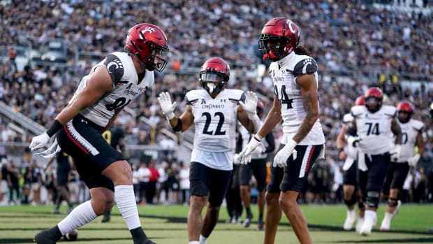 Oct 29, 2022; Orlando, Florida, USA; Cincinnati Bearcats tight end Josh Whyle (81) celebrates after making a touchdown catch against the UCF Knights in the third quarter at FBC Mortgage Stadium. UCF won 25-21.