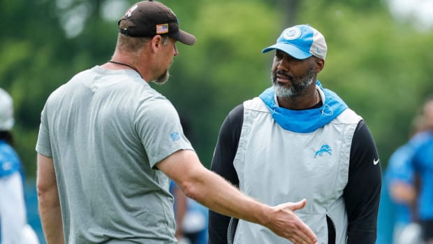 Detroit Lions general manager Brad Holmes chats with Dan Campbell