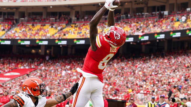 Aug 26, 2023; Kansas City, Missouri, USA; Kansas City Chiefs wide receiver Justyn Ross (8) catches a pass for a touchdown against Cleveland Browns cornerback Lorenzo Burns (27) during the first half at GEHA Field at Arrowhead Stadium. Mandatory Credit: Denny Medley-USA TODAY Sports  