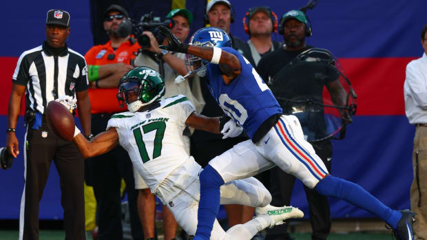 Aug 26, 2023; East Rutherford, New Jersey, USA; New York Jets wide receiver Garrett Wilson (17) fails to catch a pass while being defended by New York Giants cornerback Amani Oruwariye (20) during the first half at MetLife Stadium.