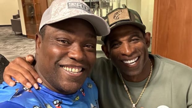 Warren Sapp poses with Deion Sanders at the University of Colorado
