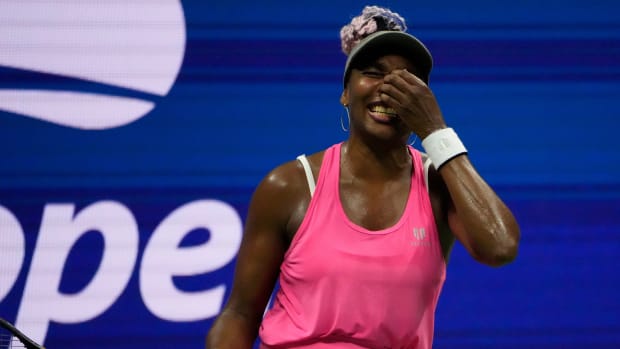 American tennis player Venus Williams hold her hand up to her face after losing a point at the U.S. Open.