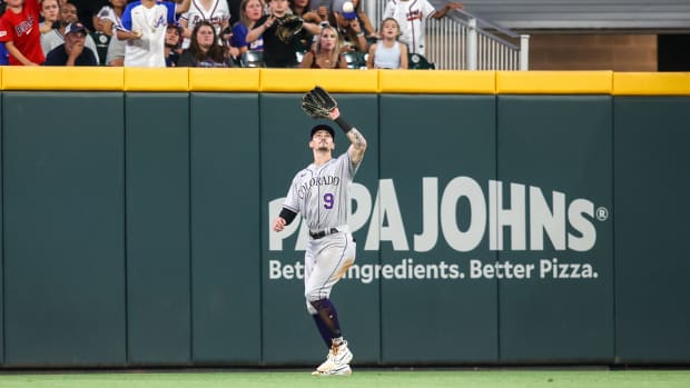 Jun 15, 2023; Atlanta, Georgia, USA; Colorado Rockies center fielder Brenton Doyle (9) catches a fly ball against the Atlanta Braves in the sixth inning at Truist Park.