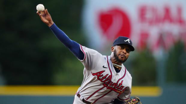 Aug 30, 2023; Denver, Colorado, USA; Atlanta Braves starting pitcher Darius Vines (64) delivers a pitch in the first inning against the Colorado Rockies at Coors Field.
