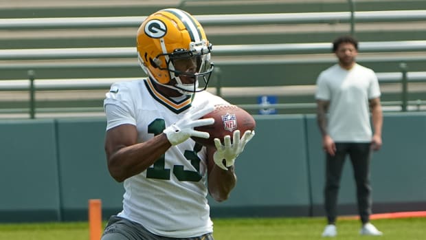Green Bay Packers wide receiver Dontayvion Wicks catches a pass during practice.