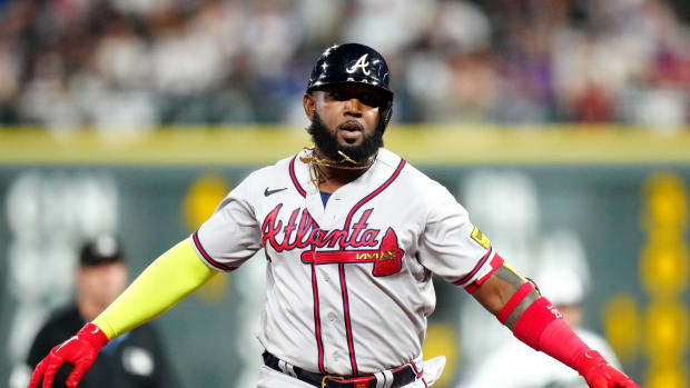 Aug 30, 2023; Denver, Colorado, USA; Atlanta Braves designated hitter Marcell Ozuna (20) celebrates his solo home run in the sixth inning against the Colorado Rockies at Coors Field.