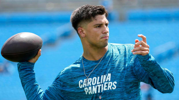 Former Panthers quarterback Matt Corral warms up before a preseason game.