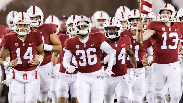 Stanford Cardinal football team runs out of the tunnel for game vs. BYU.