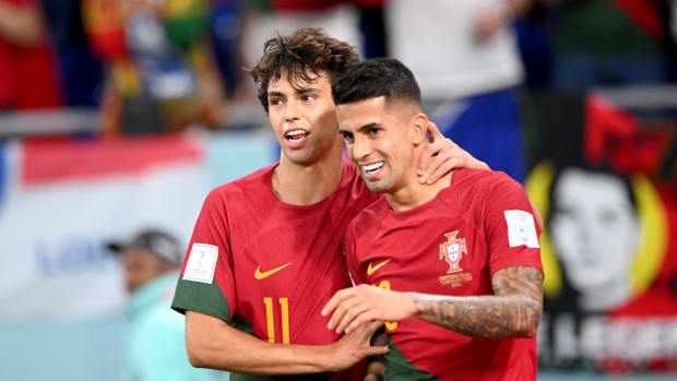 Portugal’s Joao Felix and Joao Cancelo celebrate a goal.