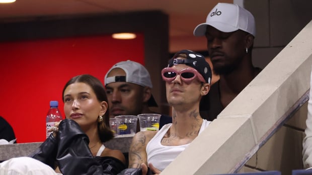 Pop star Justin Bieber sits alongside wife Hailey at the U.S. Open.
