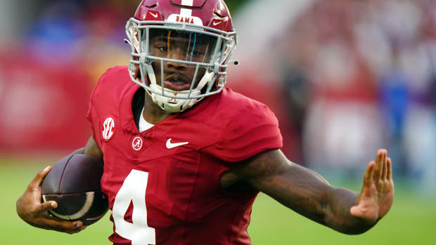 Alabama Crimson Tide quarterback Jalen Milroe (4) carries the ball against the Middle Tennessee Blue Raiders for a touchdown during the first quarter at Bryant-Denny Stadium.