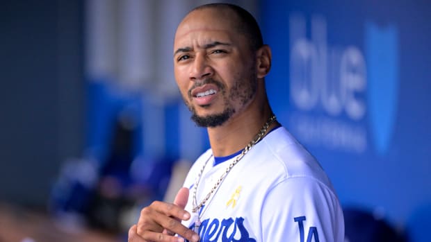 Sep 3, 2023; Los Angeles, California, USA; Los Angeles Dodgers right fielder Mookie Betts (50) looks on from the dugout in the second inning against the Atlanta Braves at Dodger Stadium.