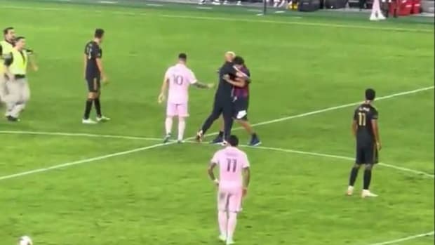 Lionel Messi's personal bodyguard Yassine Chueko pictured grappling with a pitch invader who tried to touch the Inter Miami captain during an MLS game against LAFC in September 2023