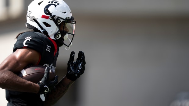 Cincinnati Bearcats wide receiver Xzavier Henderson (8) scores a touchdown in the first quarter of the NCAA football game between the Cincinnati Bearcats and the Eastern Kentucky Colonels at Nippert Stadium in Cincinnati on Saturday, Sept. 2, 2023.