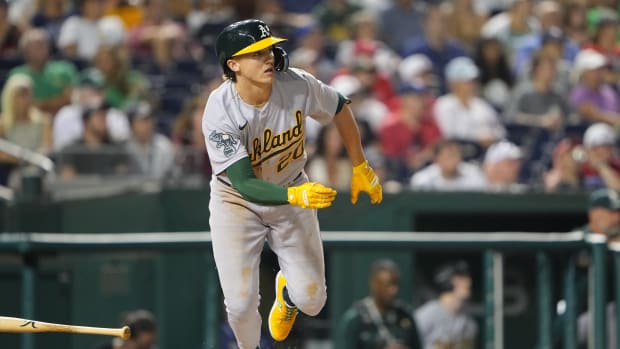 Oakland Athletics second baseman Zack Gelof (20) runs out a double against the Washington Nationals during the eighth inning at Nationals Park.