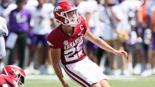 Razorbacks kicker Cam Little with an extra point in opening game