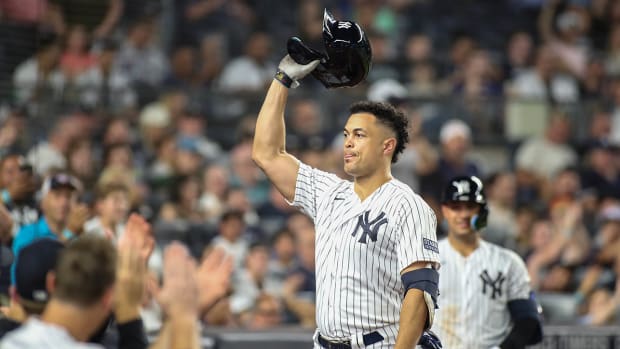 Yankees DH Giancarlo Stanton celebrates after hitting his 400th home run.