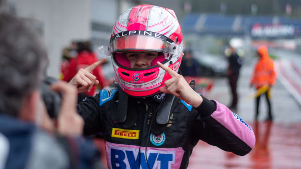Abbi pulling points to her pink racing helmet that read ‘Alpine’