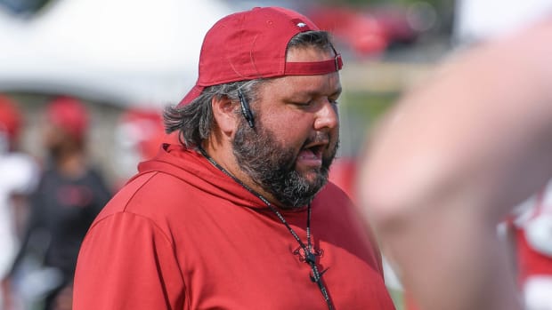 Razorbacks' offensive line coach Cody Kennedy at practice outside Tuesday