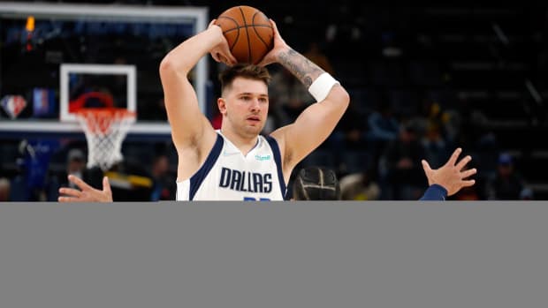 Luka Dončić and Dillon Brooks during a Mavericks-Grizzlies game on Dec. 8, 2021.