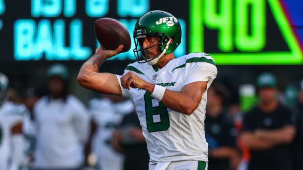 Jets' QB Aaron Rodgers (8) slings it in an NFL Preseason game against the Giants