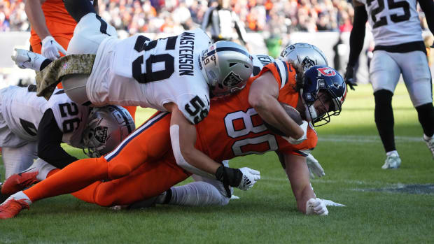 Las Vegas Raiders linebacker Luke Masterson (59) tackles Denver Broncos tight end Greg Dulcich (80) in the first quarter at Empower Field at Mile High.