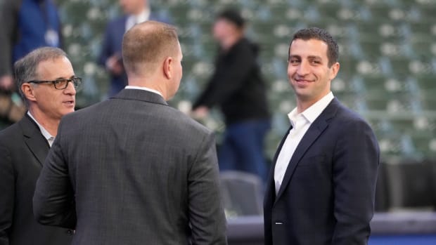 David Stearns, right, Milwaukee Brewers president of baseball operations, and Rick Schlesinger, far left, president, business operations are seen before the Milwaukee Brewers home opener against St. Louis Cardinals at American Family Field in Milwaukee on Thursday, April 14, 2022. Mjs Brewers Brewers15 0021