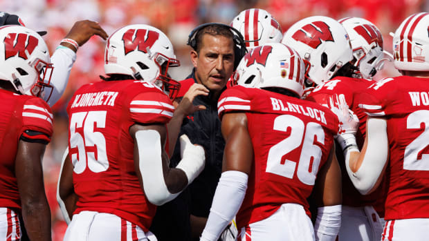 Sep 2, 2023; Madison, Wisconsin, USA; Wisconsin Badgers head coach Luke Fickell talks in a huddle during the second quarter against the Buffalo Bulls at Camp Randall Stadium. Mandatory Credit: Jeff Hanisch-USA TODAY Sports