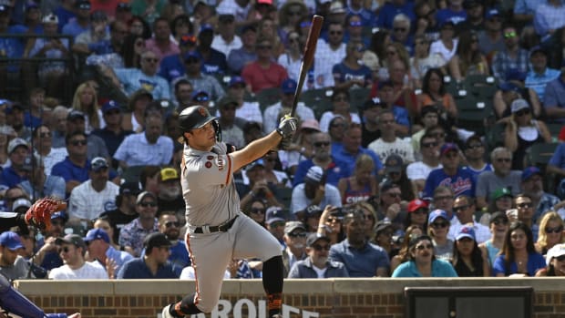 SF Giants shortstop Casey Schmitt (6) hits an RBI double against the Chicago Cubs at Wrigley Field (2023)