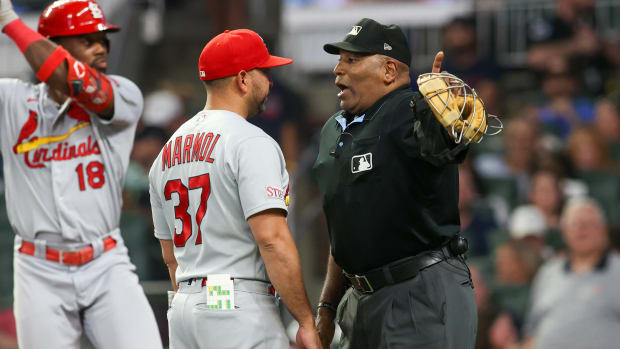 Sep 7, 2023; Atlanta, Georgia, USA; Umpire Laz Diaz (63) talks to St. Louis Cardinals manager Oliver Marmol (37) against the Atlanta Braves in the sixth inning at Truist Park.