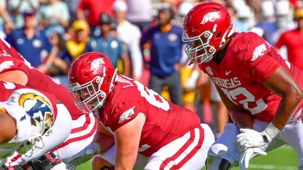 Razorbacks offensive linemen Brady Latham and Andrew Chamblee against Kent State
