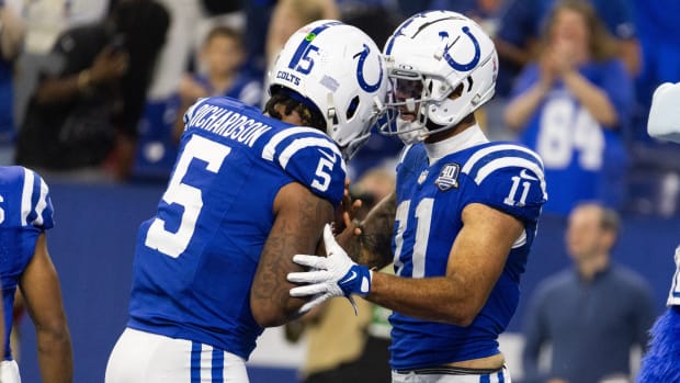 Sep 10, 2023; Indianapolis, Indiana, USA; Indianapolis Colts wide receiver Michael Pittman Jr. (11) gives his touchdown ball to quarterback Anthony Richardson (5) after scoring his first passing touchdown in the second half against the Jacksonville Jaguars at Lucas Oil Stadium.