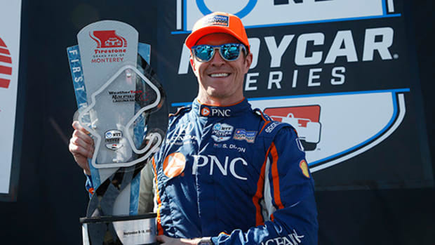 Scott Dixon shows off his shiny trophy for winning Sunday's IndyCar season finale at Laguna Seca. Photo courtesy IndyCar.