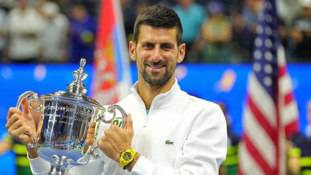 Novak Djokovic poses with the trophy after winning the 2023 U.S. Open.