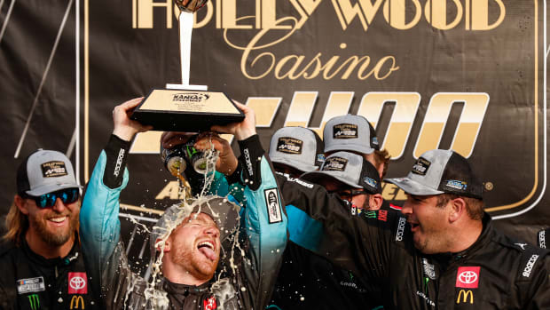 Tyler Reddick celebrates in victory lane after winning Sunday's NASCAR Cup Series Hollywood Casino 400 at Kansas Speedway. (Photo by Sean Gardner/Getty Images)