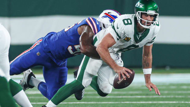 Sep 11, 2023; East Rutherford, New Jersey, USA; New York Jets quarterback Aaron Rodgers (8) is injured while being sacked by Buffalo Bills defensive end Leonard Floyd (56) during the first half at MetLife Stadium. Mandatory Credit: Vincent Carchietta-USA TODAY Sports  